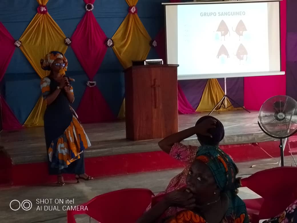 Women participating in a community health education session